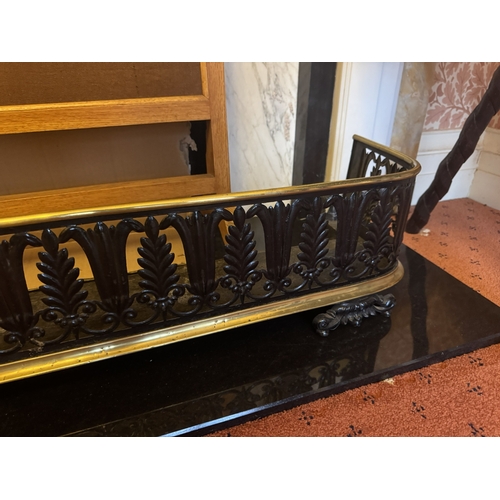 727 - Early 19th. C. brass and metal fender, decorated with foliage. { 22cm H X 105cm W X 24cmD }.