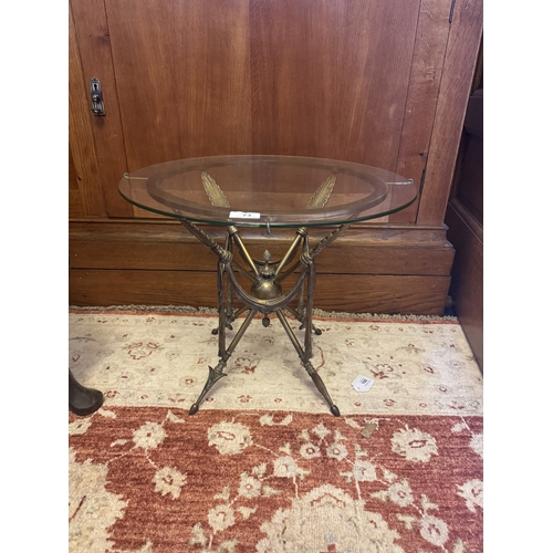 73 - French brass and glass campaign table, the base decorated with acanthus leaves. { 42cm H X 50cm Dia ... 