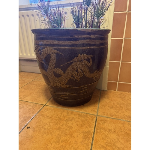 733 - Glazed terracotta planter, decorated with a dragon, in the Arts and Crafts manner. { 45cm H X 42cm D... 