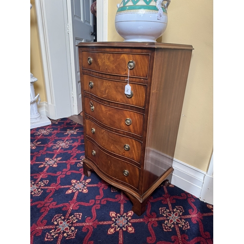 745 - Early 20th. C. serpentine fronted mahogany chest with five graduated long drawers, raised on plinth ... 