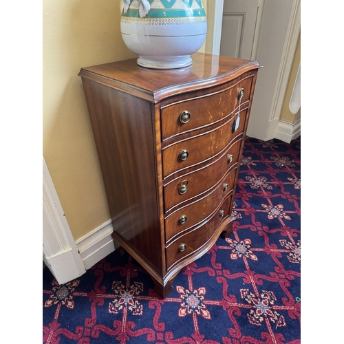 745 - Early 20th. C. serpentine fronted mahogany chest with five graduated long drawers, raised on plinth ... 