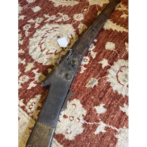 75 - Early 19th. C. Arabian matlock rifle. { 179cm L }.