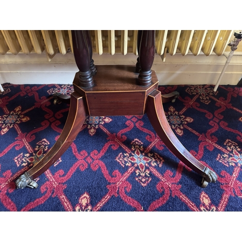 764 - Regency inlaid  mahogany turn over tea table, raised on fout turned columns, three outawpt feet term... 