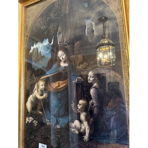 766 - Leonardo Da Vinci The Virgin on the Rocks coloured print mounted in gilt frame. {80 cm H x 55 cm W}