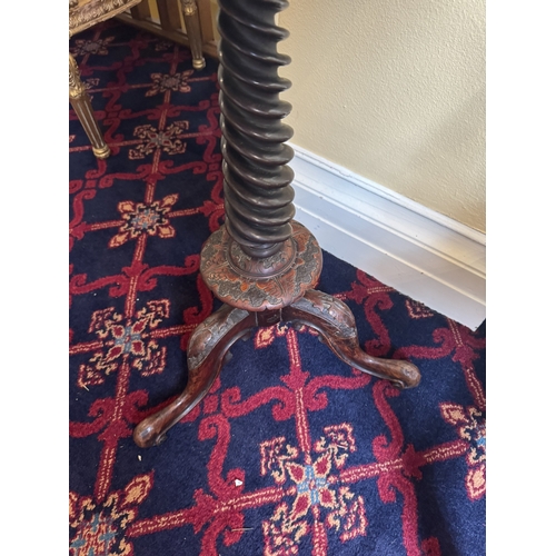 767 - 19th. C. oak wine table decorated with oak leaves, raised on turned spiral column and three outswept... 