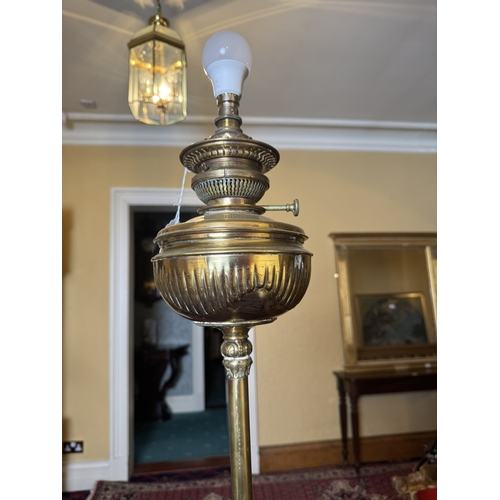 768 - Exceptional quality 19th C. decorative brass standard lamp {165 cm H x 59 cm Dia.}.