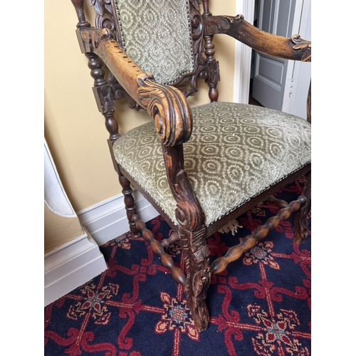 771 - 19th. C. carved upholstered walnut open armed hall chair, decorated with oak leaves, raised on shape... 