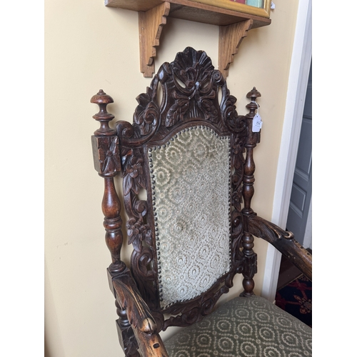 771 - 19th. C. carved upholstered walnut open armed hall chair, decorated with oak leaves, raised on shape... 