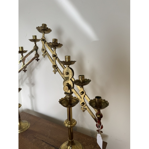 781 - Pair of 19th. C. brass Ecclesiastical candlesticks. { 55cm H X 321cm Dia }.