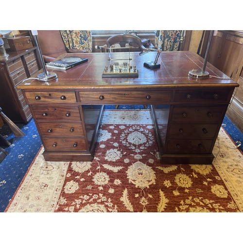 81 - 19th. C. mahogany partner's desk with tooled leather inset, with centre short drawer flanked by two ... 