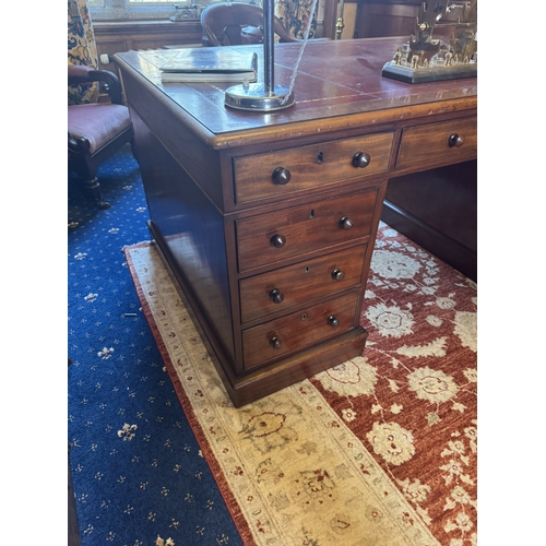 81 - 19th. C. mahogany partner's desk with tooled leather inset, with centre short drawer flanked by two ... 