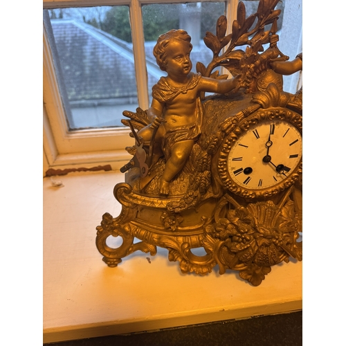 812 - 19th. C. gilded metal mantle clock, surmounted with Children and Foliage. { 36cm H X 44cm W X 17cm D... 