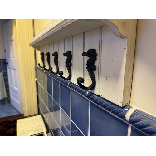 817 - Painted pine wall coat hanger, the hooks in the form of sea horses. { 22cm H X 88cm W X 11cm D }.