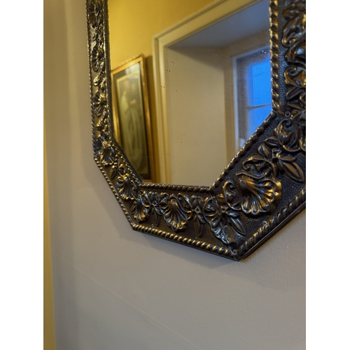 825 - Pair of brass wall mirrors with bevelled platesand decoarted with foliage. { 73cm H X 43cm W }.