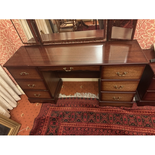 844 - Modern mahogany dressing , the three mirrors above a long centre drawer flanked by six short drawers... 