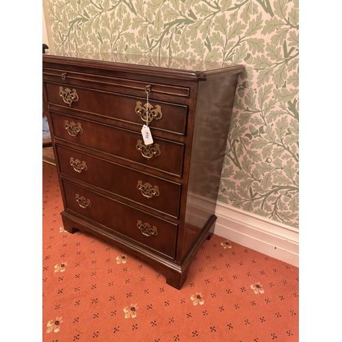 859 - Early 20th. C. mahogany chest, the brushing slide above four graduated long drawers, raised on brack... 