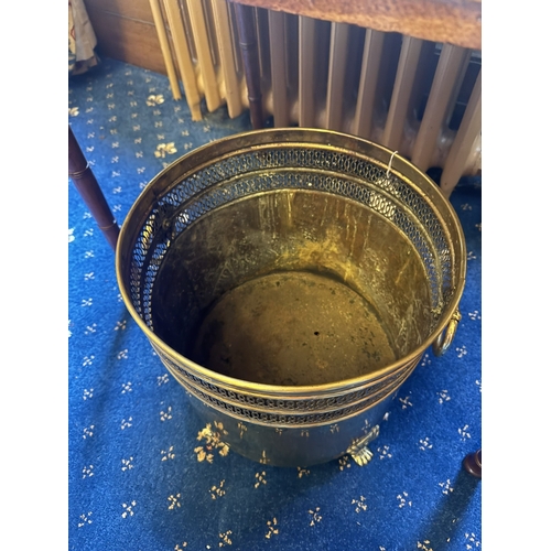 90 - Early 20th. C. brass waste paper bucket, raised on paw feet. { 32cm H X 31cm Dia }.