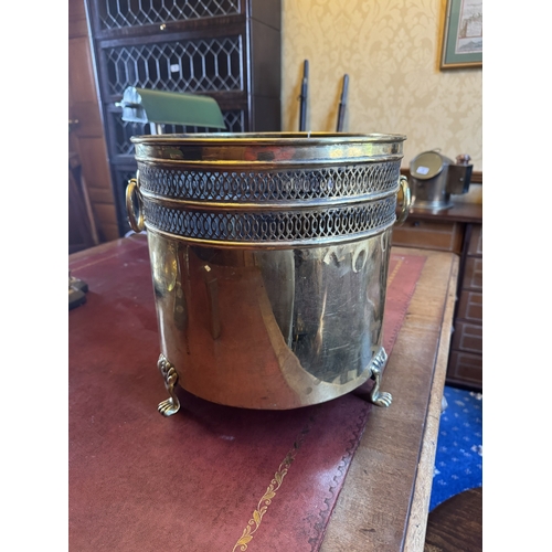 90 - Early 20th. C. brass waste paper bucket, raised on paw feet. { 32cm H X 31cm Dia }.