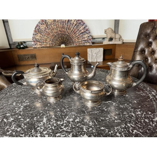 979 - Five piece Irish silver tea service, the teapot, coffee pot and hot water pot with wooden handles an... 