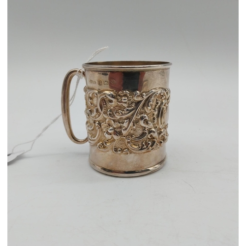 1003 - English silver mug with repousse decoration. Hallmarked in Birmingham. Maker: William Henry Sparrow ... 