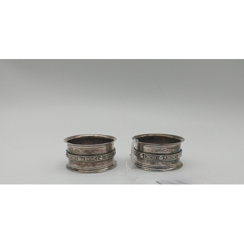 1009 - Pair of English silver Celtic Knot design napkin rings. Hallmarked in Birmingham. Maker: David Lawre... 