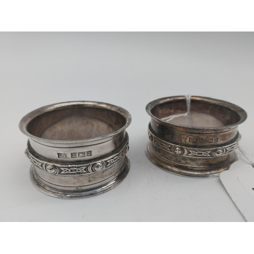 1009 - Pair of English silver Celtic Knot design napkin rings. Hallmarked in Birmingham. Maker: David Lawre... 