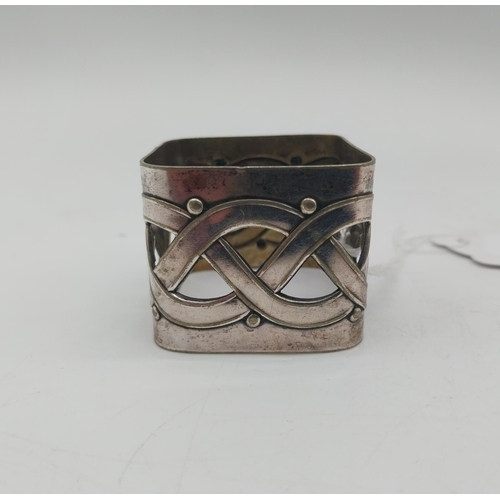 1010 - Two silver plated napkin rings . Square holder stamped WMFN x/o OX. Circular holder decorated with a... 