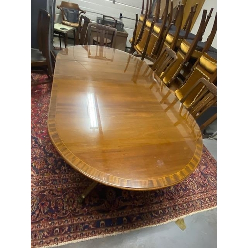 1112 - Inlaid mahogany dining room table, raised on double turned pod each with three outswept feet. { 74cm... 