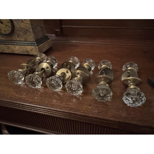 140 - Six early 20th. C. glass and brass door handles. { 17cm L }.