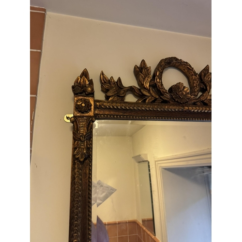 687a - Gilt wall mirror, in the Victorian style. { 108cm H X 72cm W }.