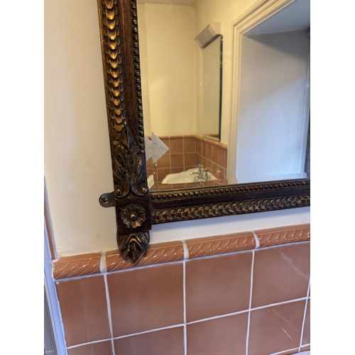 687a - Gilt wall mirror, in the Victorian style. { 108cm H X 72cm W }.