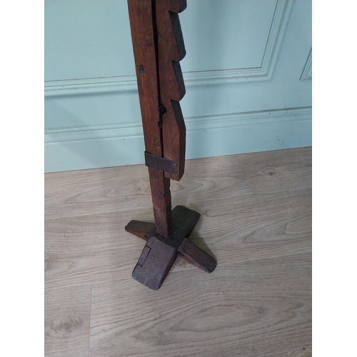 102 - Rare 19th. C. adjustable trammel oak floor rush holder with iron cup jaws, raised on a crucifix base... 