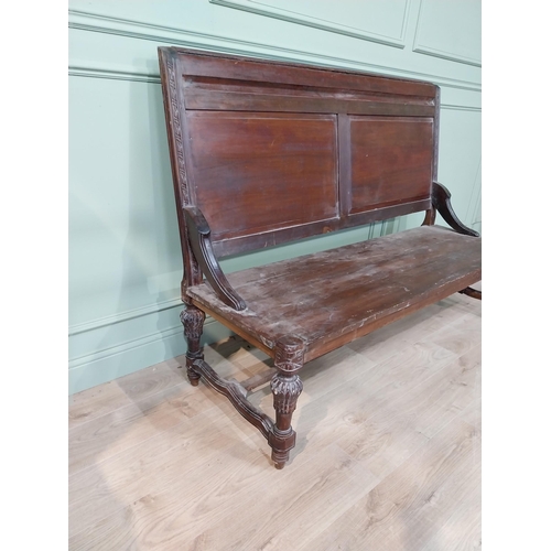 460a - Carved hardwood hall bench the back with two raised inset panels, raised on turned tapered legs and ... 