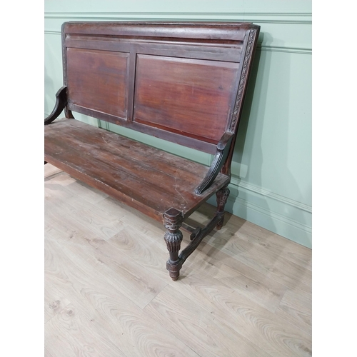 460a - Carved hardwood hall bench the back with two raised inset panels, raised on turned tapered legs and ... 