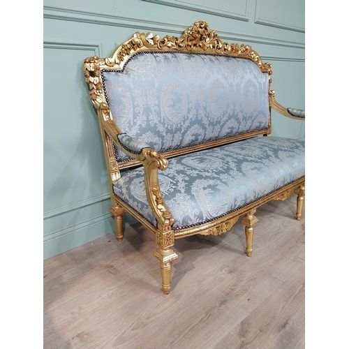 698 - Ornate French giltwood upholstered sofa, raised on turned tapered legs. { 125cm H X 164cm W X 67cm D... 