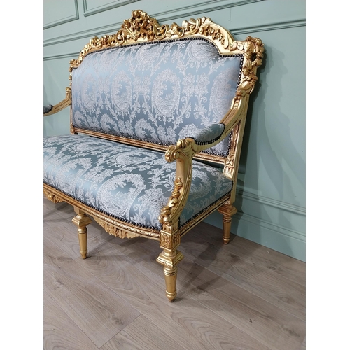 698 - Ornate French giltwood upholstered sofa, raised on turned tapered legs. { 125cm H X 164cm W X 67cm D... 