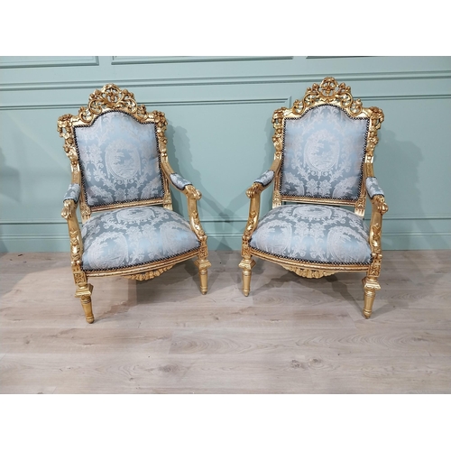 698A - Pair of ornate French giltwood upholstered open armchairs., raised on turned tapered legs. { 119cm H... 