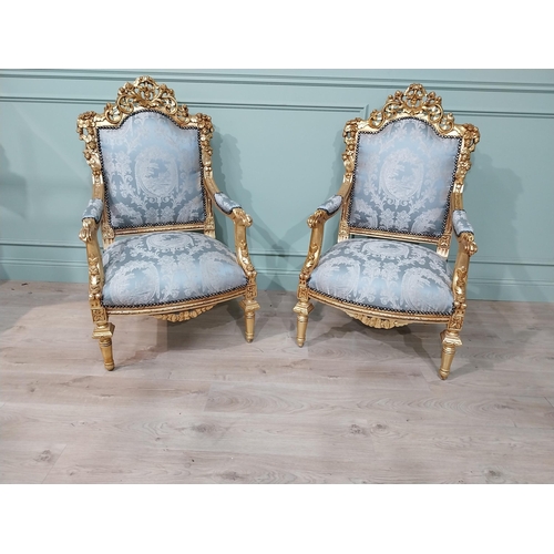 698A - Pair of ornate French giltwood upholstered open armchairs., raised on turned tapered legs. { 119cm H... 