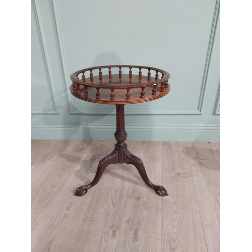 70A - Mahogany ship's table  with gallery top on single turned column on tripod base with claw and ball fe... 