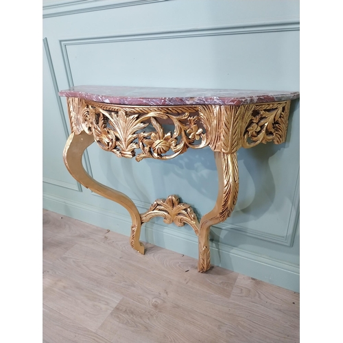 720A - French gilt console table with marble top in the Victorian style.