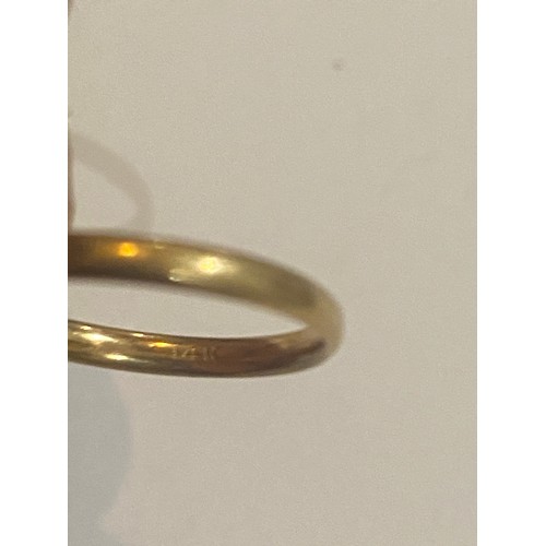 1037 - 14K Gold ring. Size K.  Gold wedding ring, stamped Solid Gold. Size N and a scrap yellow metal ring.