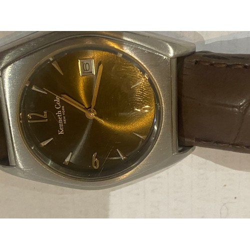 1040 - Kenneth Cole gent's wrist watch with date feature and Miller leather strap.