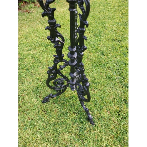 377 - Decorative cast iron garden table on three outswept legs. {70 cm H x 36 cm Dia.}.