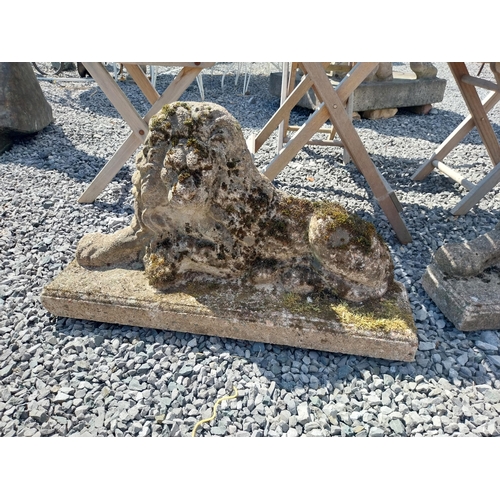 166 - Pair of weathered composition flat back Lions. {41 cm H x 72 cm W x 18 cm D}.