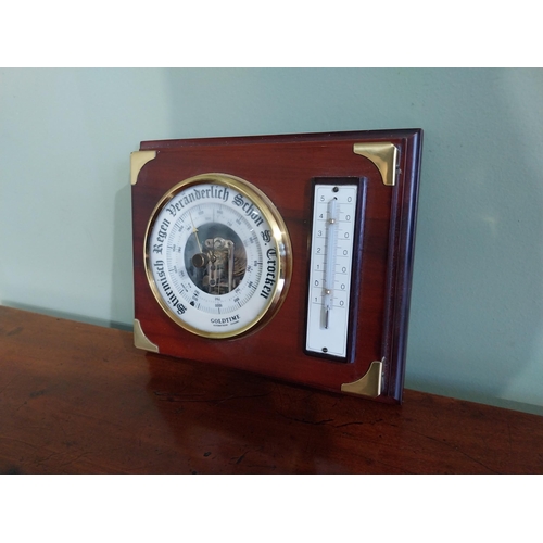21 - German mahogany and brass barometer {17 cm H x 21 cm W}.