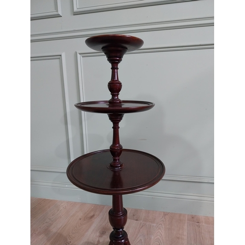 58 - Good quality mahogany three tiered dumbwaiter in the Georgian style {98 cm H x 35 cm Dia.}.