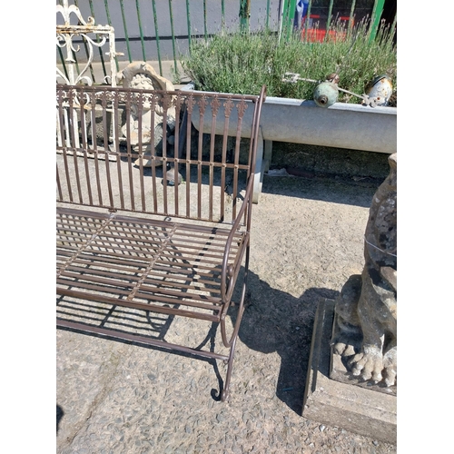 31 - Wrought iron garden bench. {85 cm H x 102 cm W x 70 cm D}.