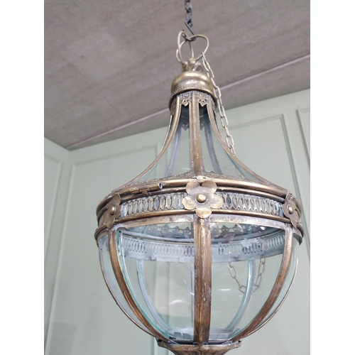 1 - Decorative gilded metal hanging lantern with glass panels. {66 cm H x 30 cm Dia.}.