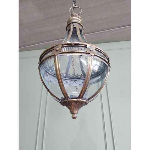 1 - Decorative gilded metal hanging lantern with glass panels. {66 cm H x 30 cm Dia.}.
