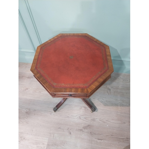 11 - Good quality mahogany octagonal lamp table with inset leather top and short drawers in frieze on tur... 